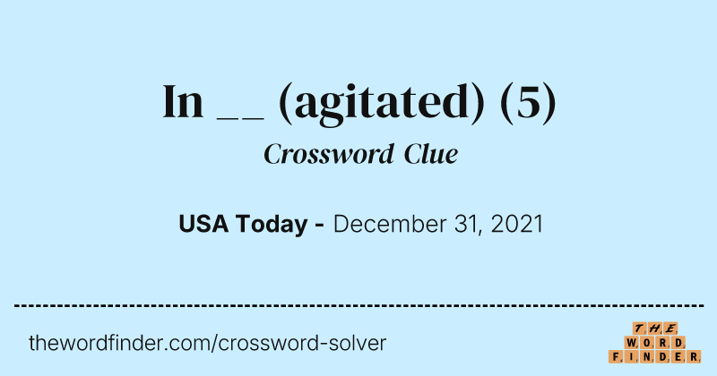 In __ (agitated) crossword clue image
